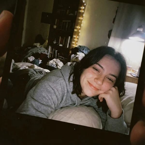 Mediocre iPhone Selfie: 19 - Year - Old Girl in Messy Bedroom