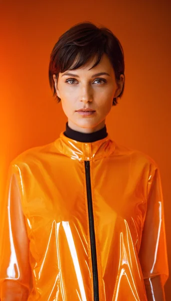 Futuristic Woman in Transparent Raincoat