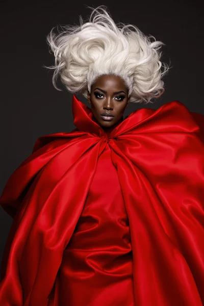 Dramatic Fashion Portrait: Woman with White Hair and Red Dress