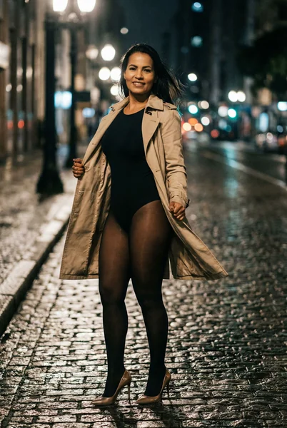 High - Fashion Editorial Portrait: Woman on Wet Cobblestone Street